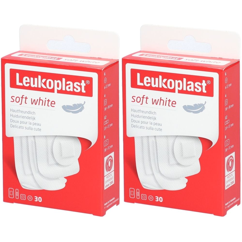 Zwei rote Kartons mit weißen Pflastern. Aufdruck: Leukoplast soft white. Enthält 30 Stück. Aufschrift in Deutsch, Niederländisch, Französisch und Italienisch.