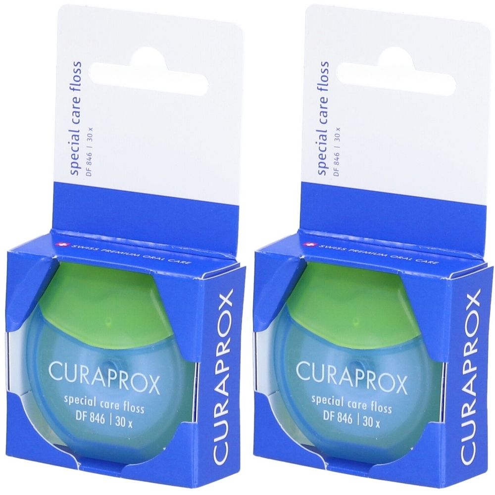 Zwei Packungen Zahnseide. Blaue und grüne Behälter mit weißer Aufhängung. Schriftzug: CURAPROX, special care floss, DF 846 | 30x.