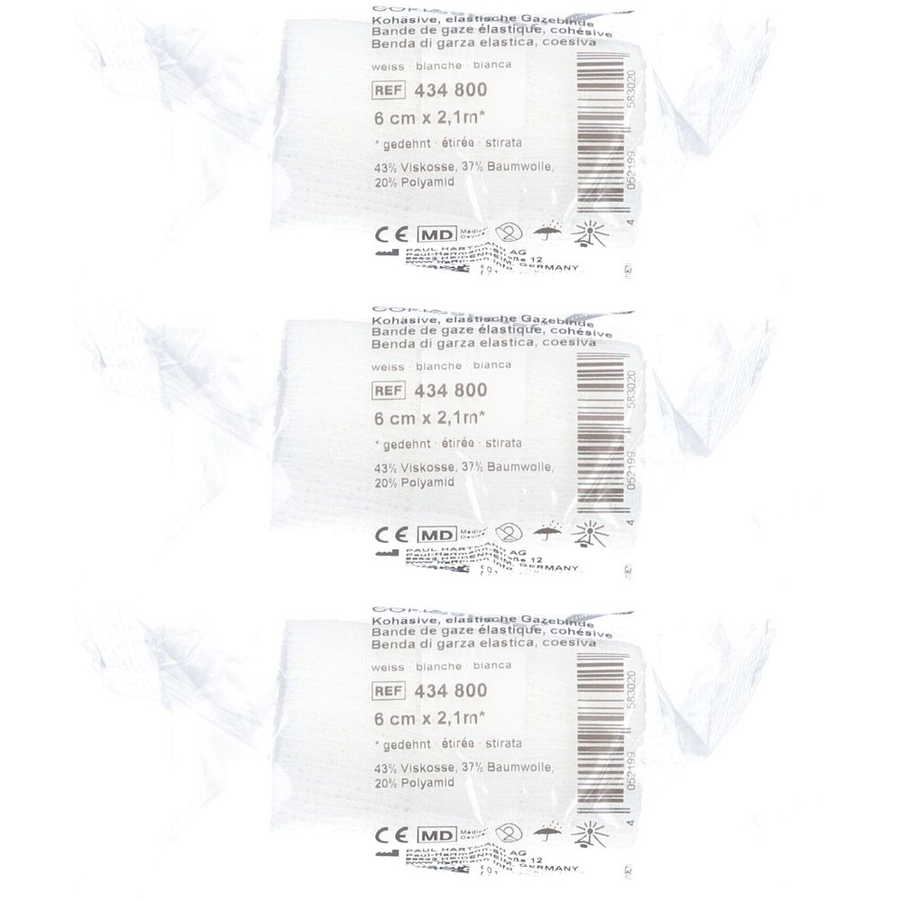 Trois rouleaux de bandage blanc. Inscription : 6 cm x 2,1 m. Matériaux : viscose, coton, polyamide. Avec marquage CE.