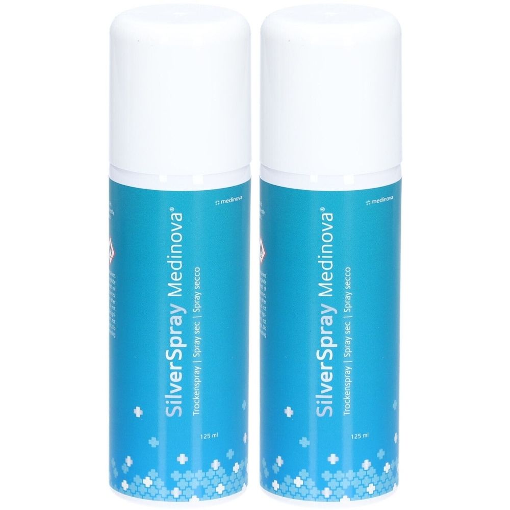 Deux flacons de spray SilverSpray Medinova. Étiquettes bleues avec texte blanc. Bouchons blancs. Inscription : Trockenspray | Spray sec | Spray secco.