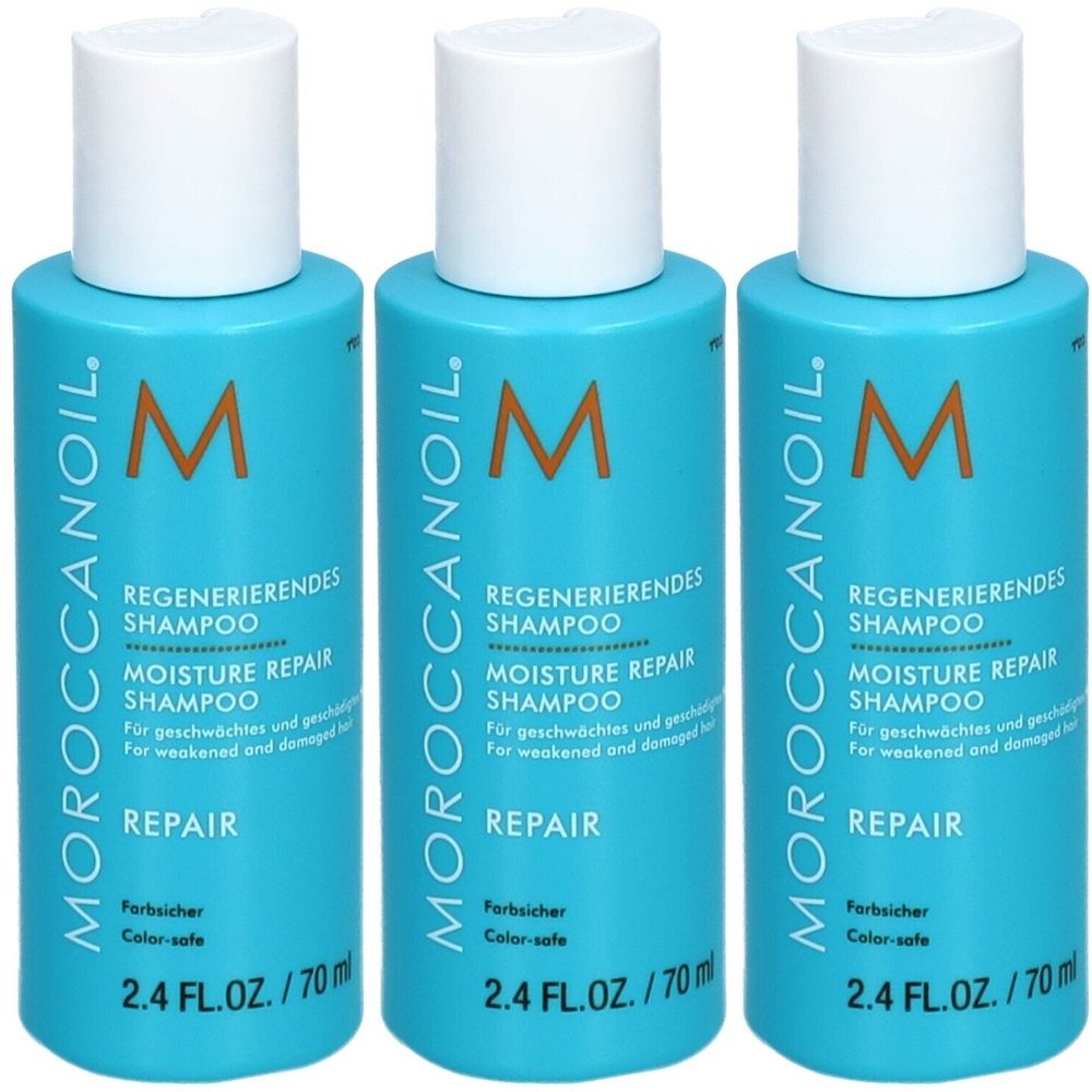 Drei blaue Shampoo-Flaschen mit weißem Deckel. Aufschrift: Moroccanoil, Regenerierendes Shampoo, Moisture Repair Shampoo.