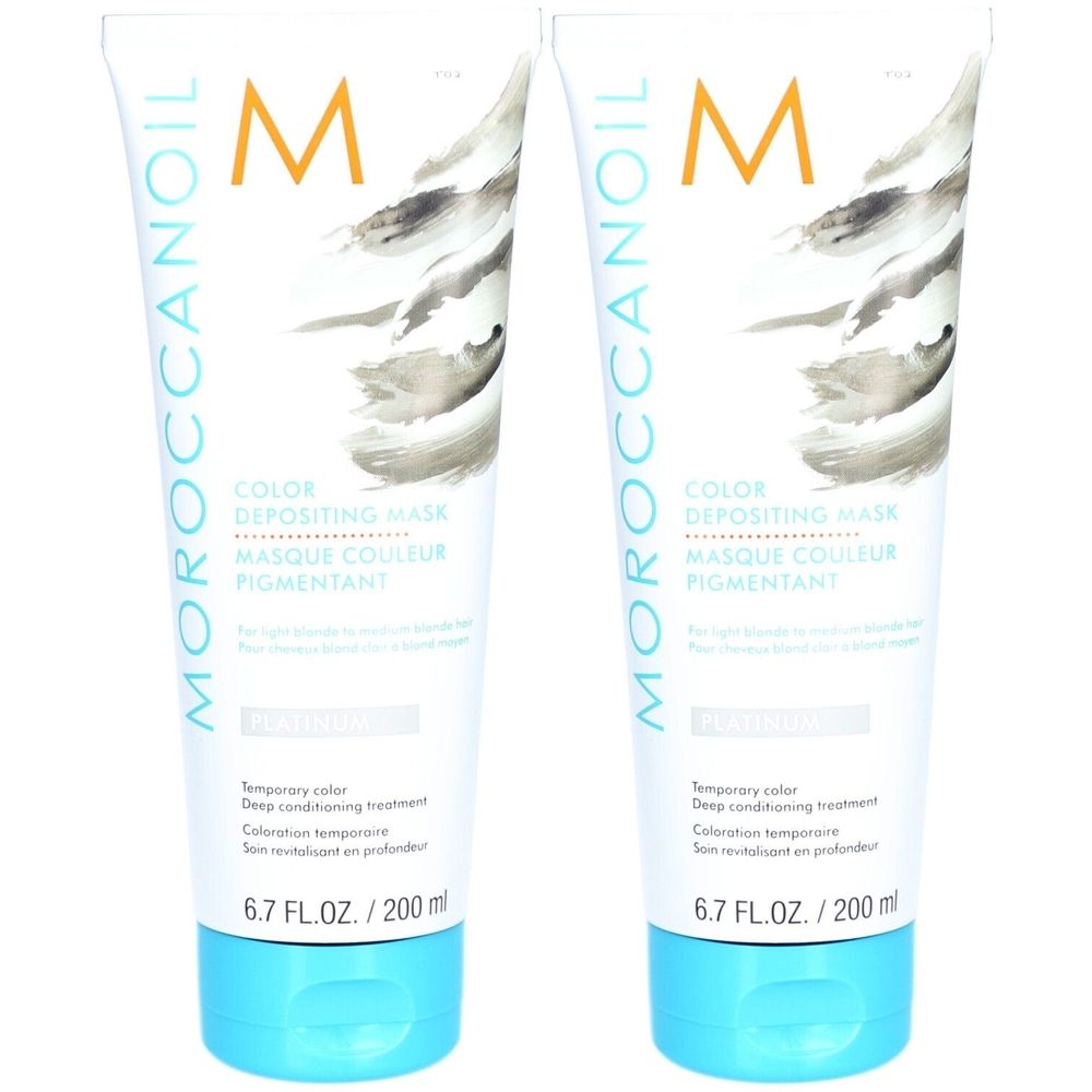Zwei Tuben Moroccanoil Color Depositing Mask. Weiß, mit blauem Verschluss. Text: Color Depositing Mask, 6.7 FL.OZ./200 ml.