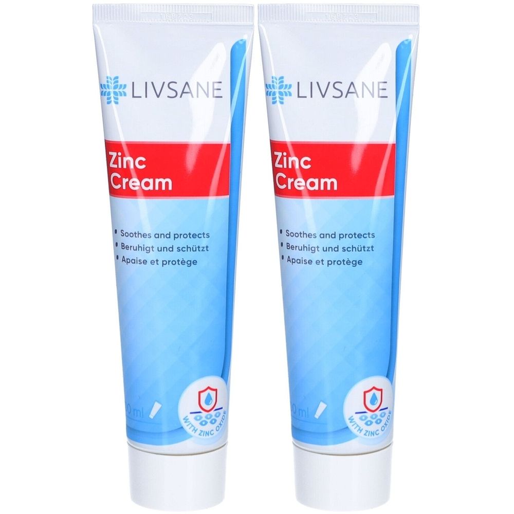 Zwei Tuben LIVSANE Zink-Creme. Weiße Tuben mit blauem und rotem Design. Aufschrift: Zinc Cream. Enthält Zink. Beruhigt und schützt.