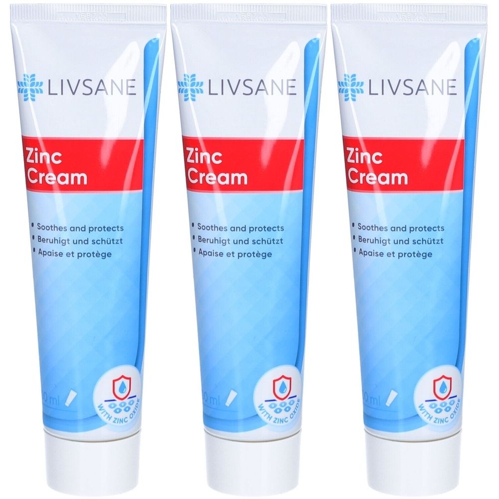 Drei Tuben LIVSANE Zink-Creme. Blaue und weiße Verpackung mit rotem Streifen. Aufschrift: Zink Cream, beruhigt und schützt.
