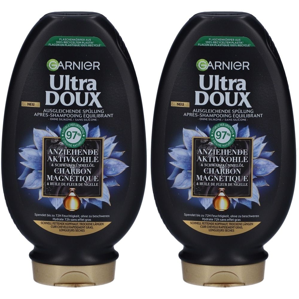 Deux flacons noirs avec bouchons dorés. Inscription: Garnier Ultra Doux, Après-shampooing équilibrant. Avec charbon magnétique et huile.