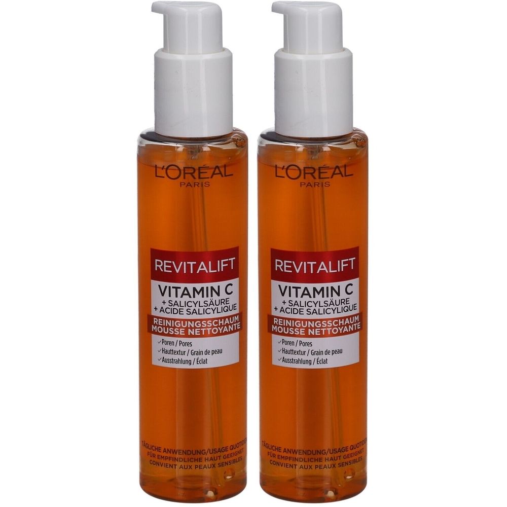 Deux flacons de mousse nettoyante L'Oréal Revitalift Vitamin C. Liquide orange dans des flacons transparents avec des pompes blanches.