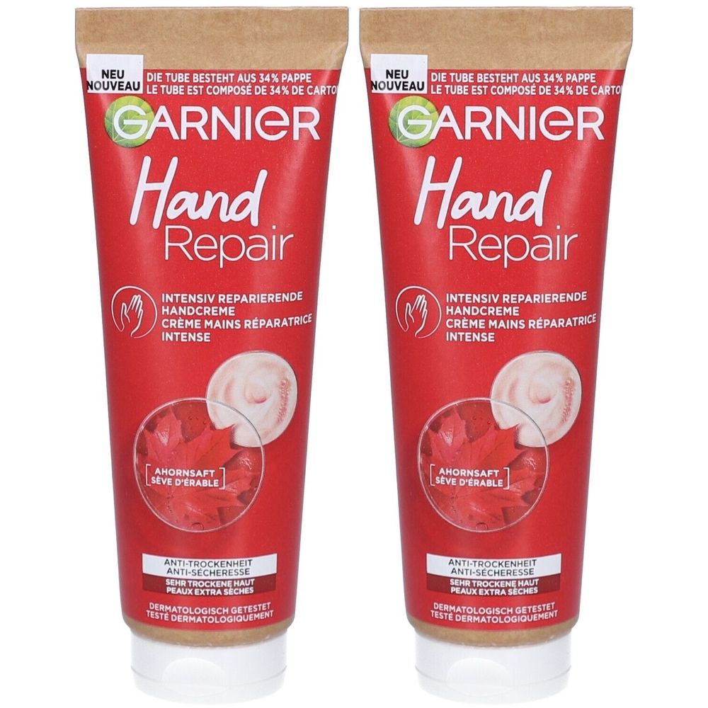 Zwei Tuben Handcreme. Rote Tuben mit weißem Deckel. Aufschrift: GARNIER Hand Repair. Text in Deutsch und Französisch. Mit Ahornsaft.