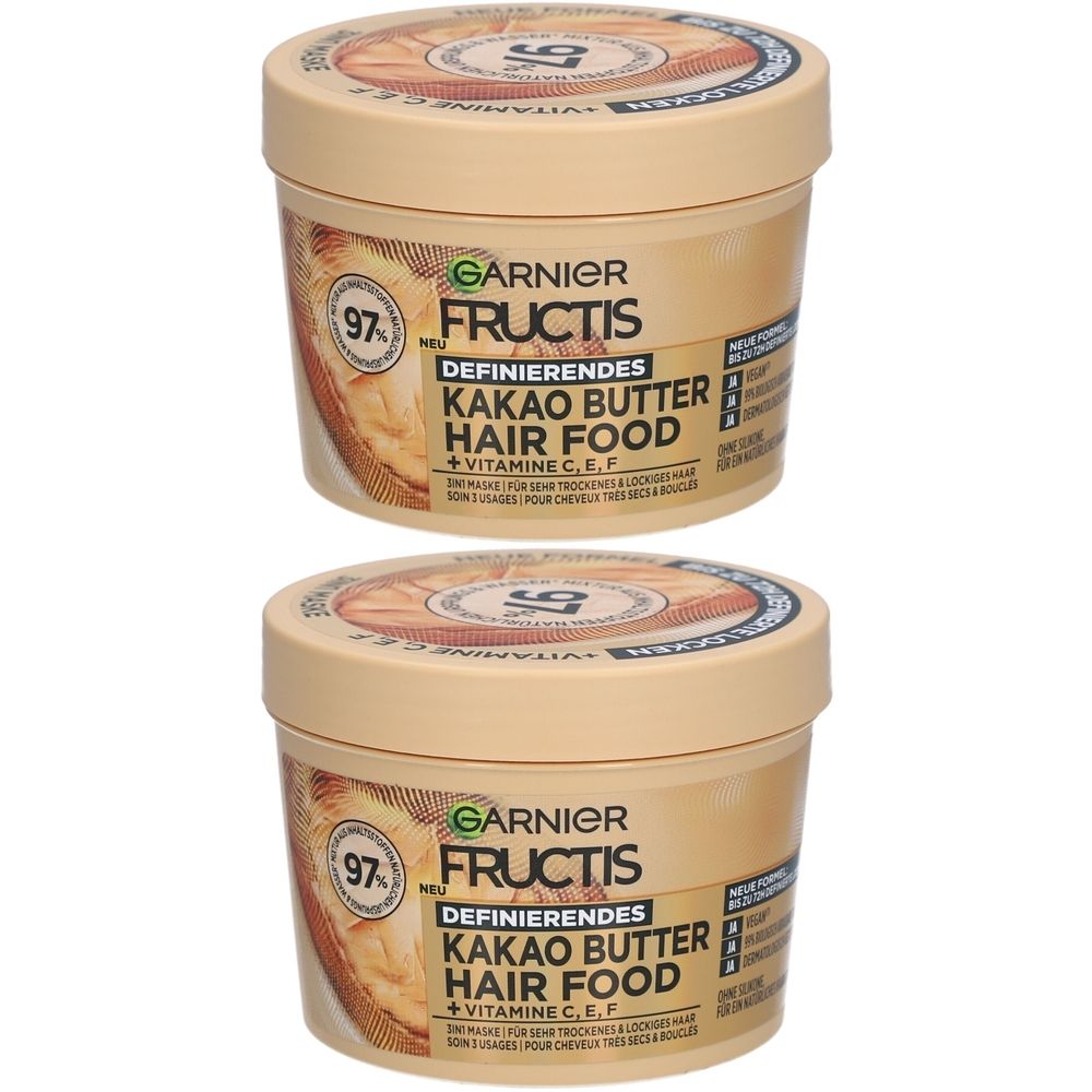 Deux pots crème. Inscription: Garnier Fructis Kakao Butter Hair Food. Avec 97% d'ingrédients naturels et vitamines.