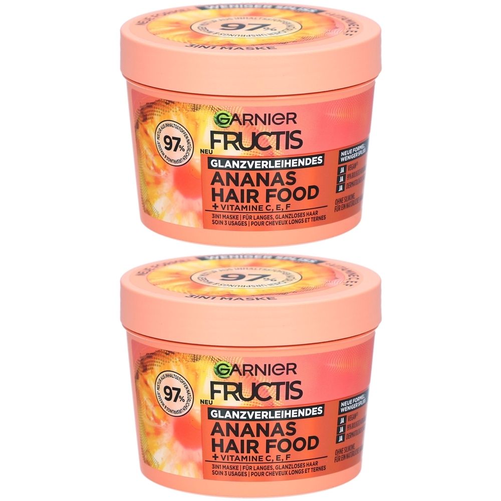 Zwei rosa Tiegel mit Deckel. Aufschrift: Garnier Fructis Ananas Hair Food. Mit 97% Inhaltsstoffen natürlichen Ursprungs.