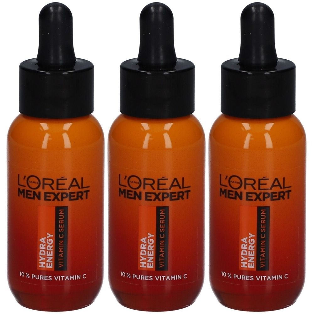 Drei Flaschen L'Oréal Men Expert Hydra Energy Vitamin C Serum. Orangefarbene Flaschen mit schwarzen Deckeln und Pipetten.