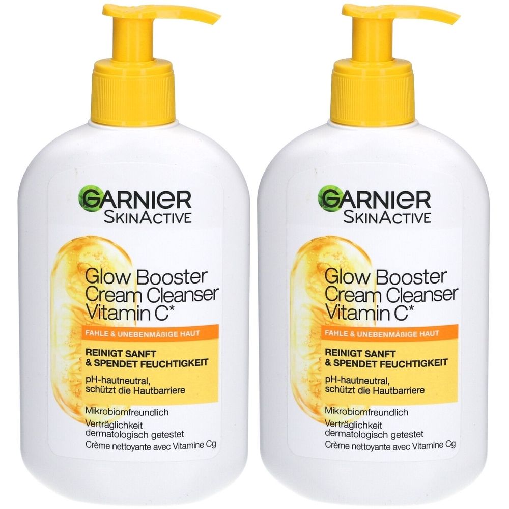 Deux flacons blancs avec pompes jaunes. Inscription: GARNIER SKINACTIVE Glow Booster Cream Cleanser Vitamin C.