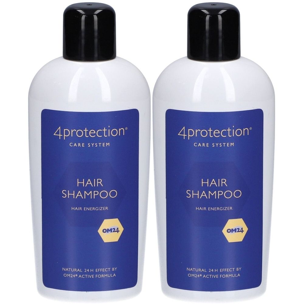 Deux flacons de shampooing blancs avec bouchons noirs. Étiquettes bleues avec texte: 4protection, HAIR SHAMPOO, logo OM24. Inscription: Natural 24 H Effect.