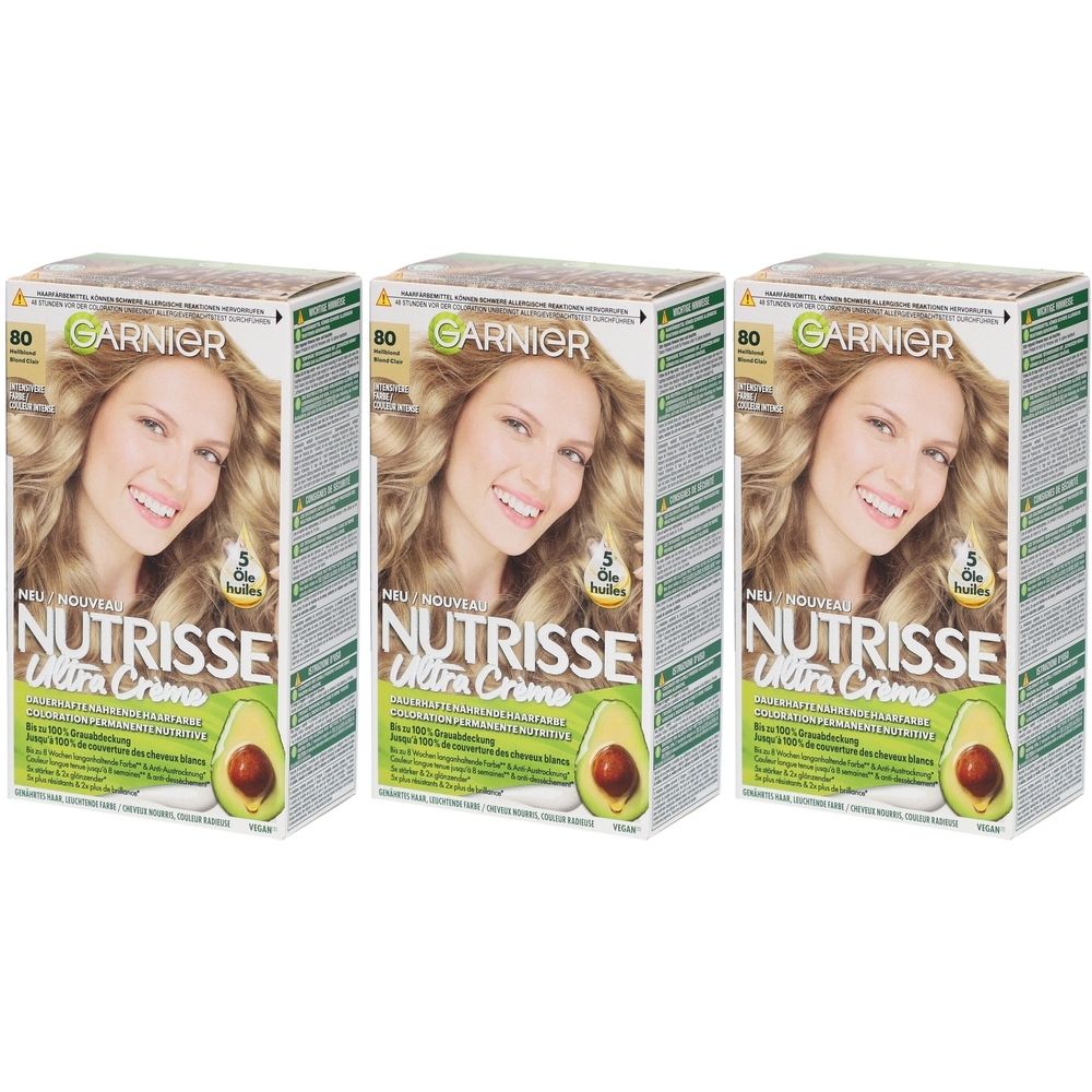 Trois boîtes de coloration Garnier Nutrisse Ultra Crème. Inscription : 80 Blond clair, femme blonde, avocat.