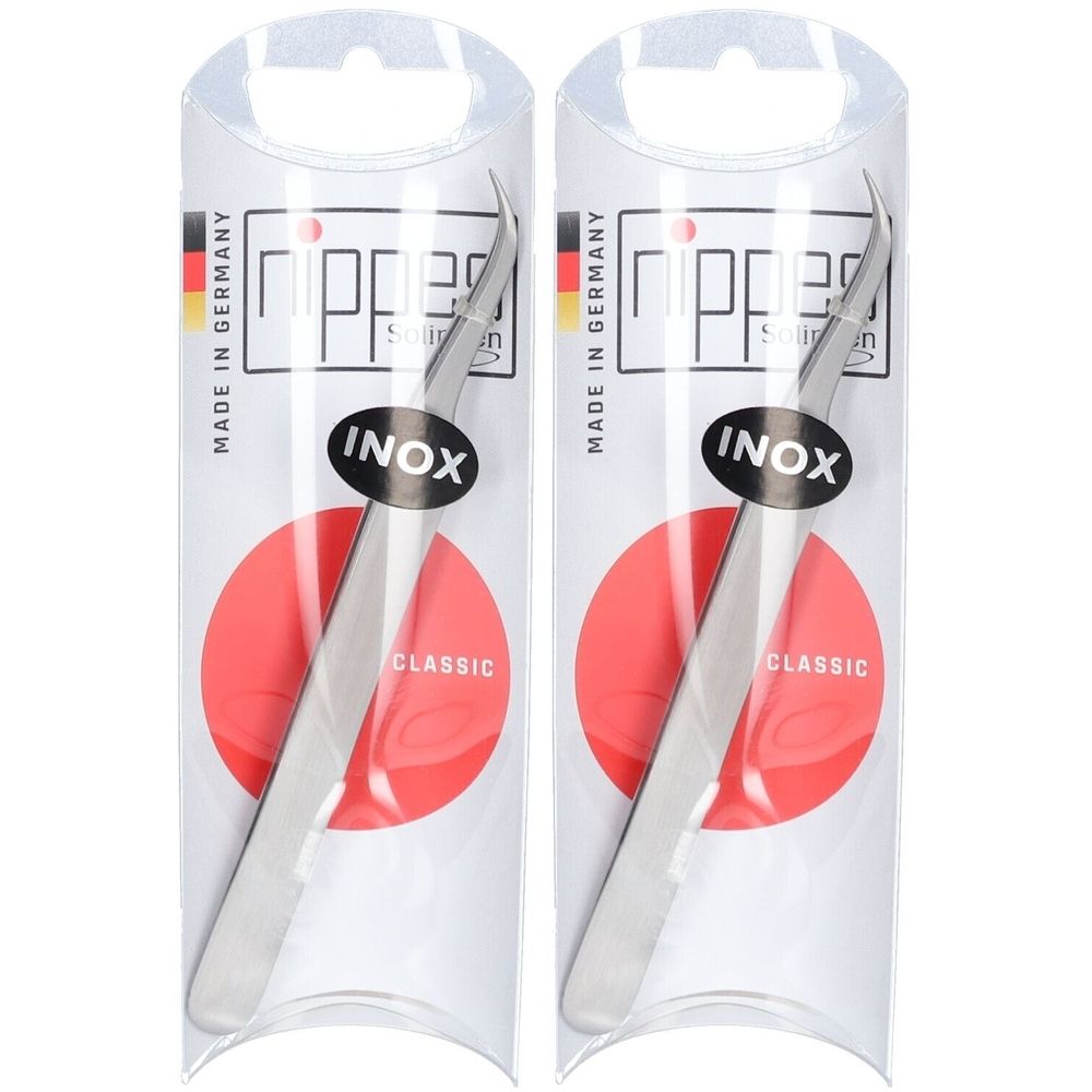 Zwei Zeckenpinzetten in Verpackung. Gebogen, Edelstahl. Auf rotem Kreis, Text: INOX, CLASSIC.