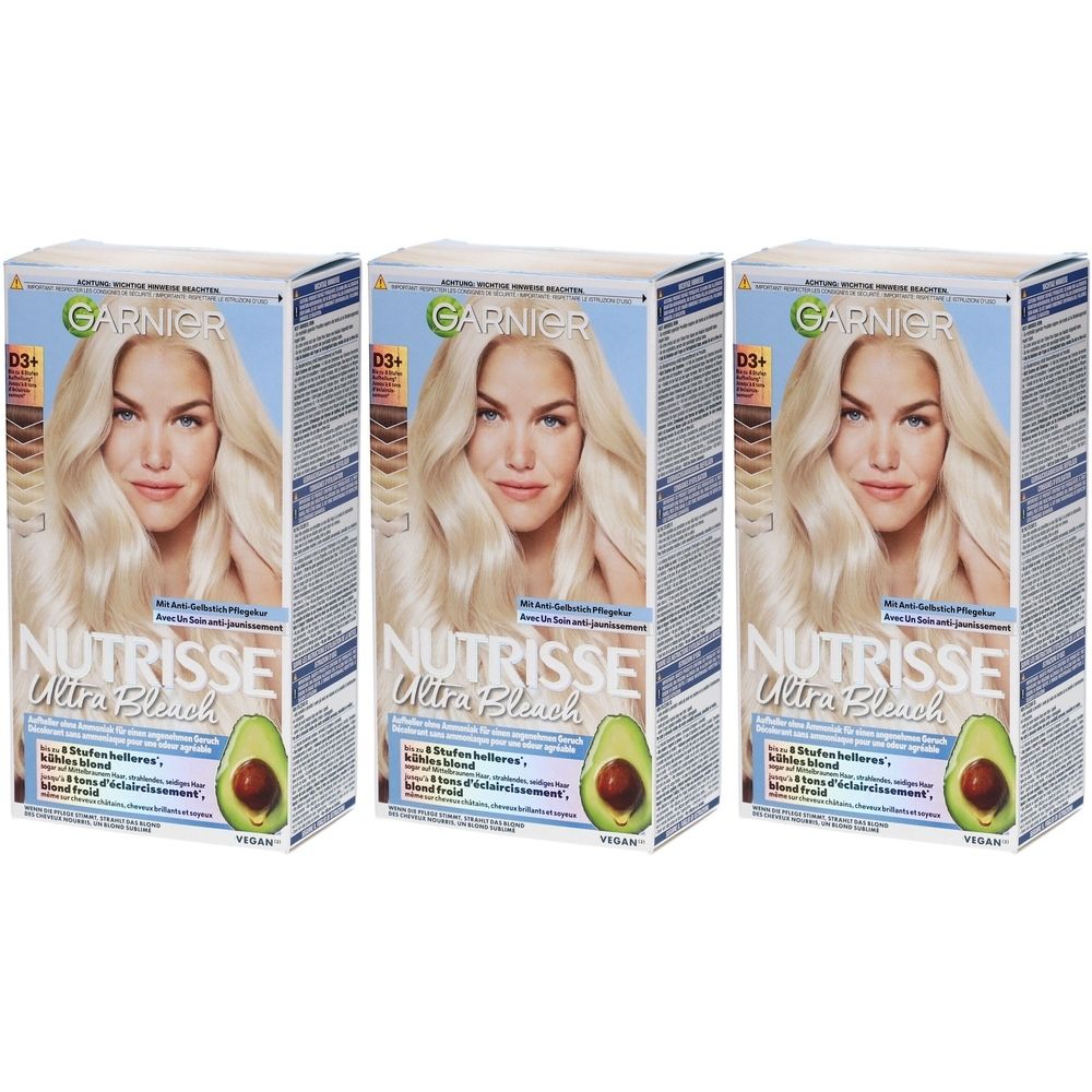 Trois boîtes de Garnier Nutrisse Ultra Bleach. Chaque boîte présente un modèle blond et un avocat.