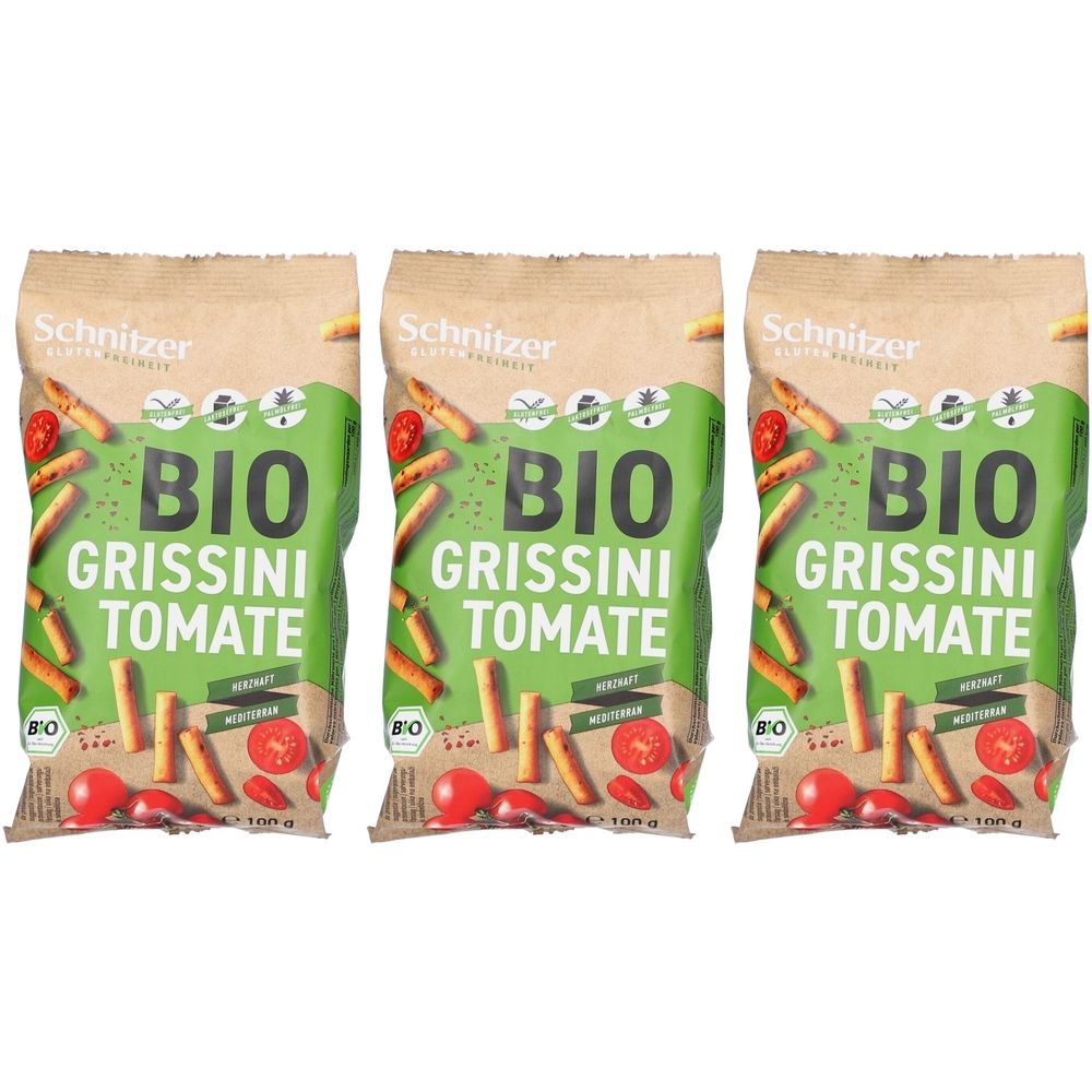 Drei Packungen Grissini Tomate. Aufschrift: BIO, Schnitzer. Verpackung mit Tomaten- und Grissini-Illustrationen.