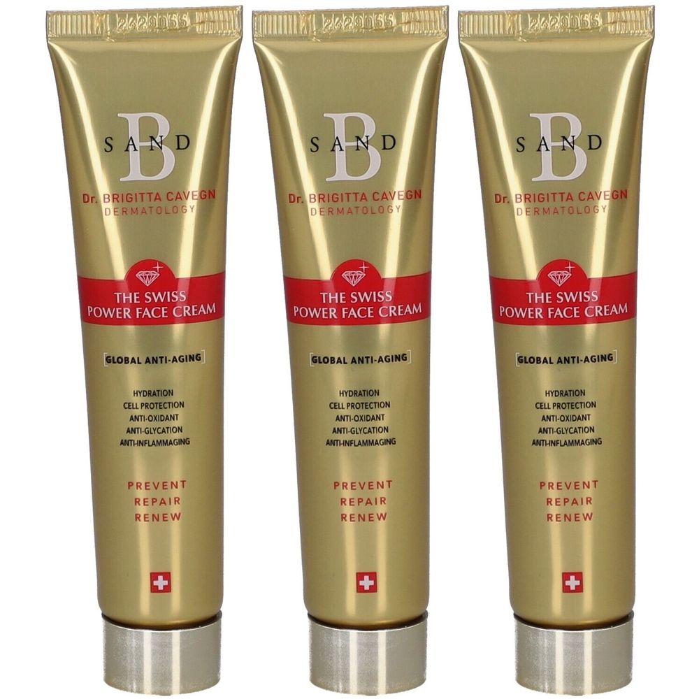 Trois tubes dorés avec bande rouge. Inscription: SAND, Dr. Brigitta Cavegn, THE SWISS POWER FACE CREAM, Global Anti-Aging.
