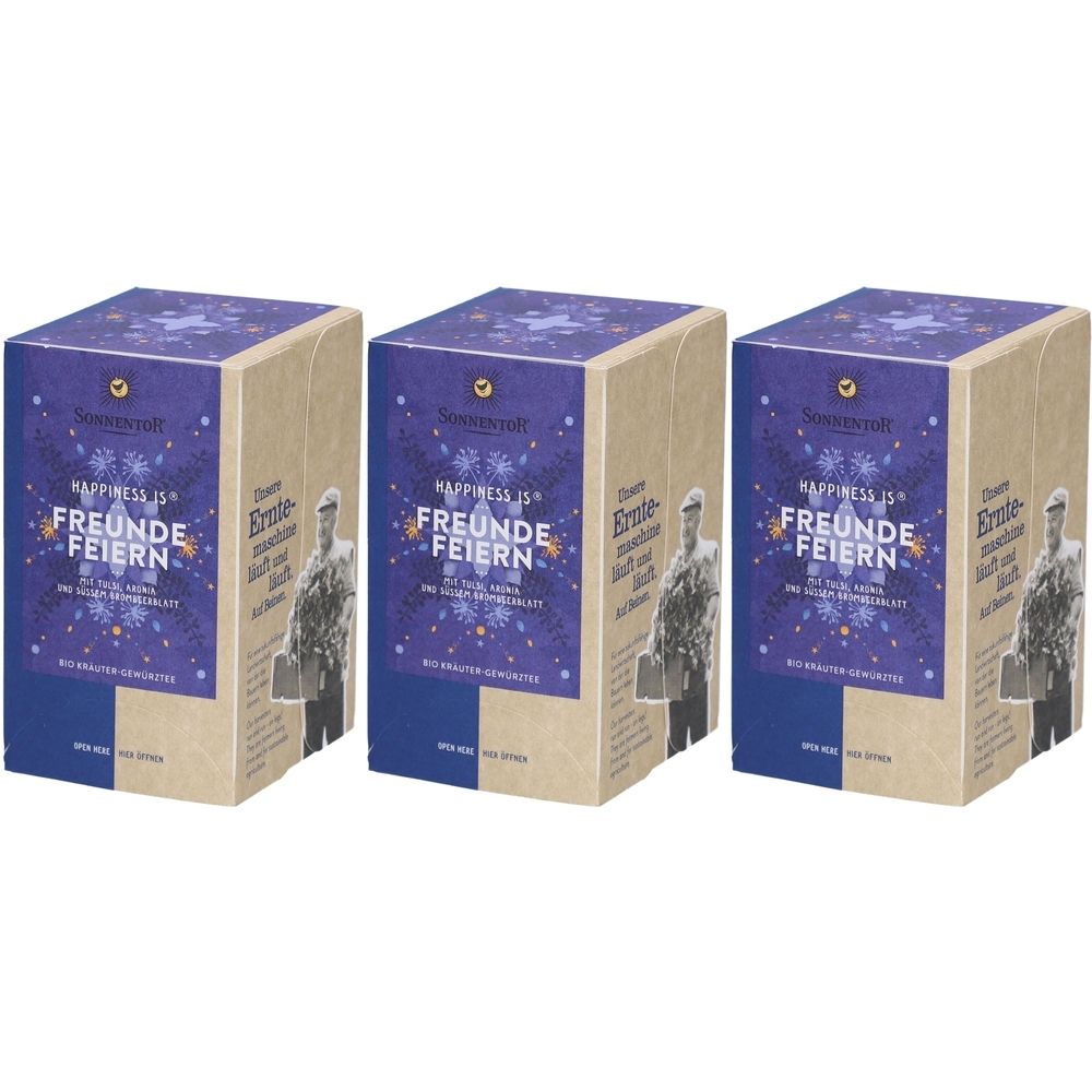 Trois boîtes en carton rectangulaires. Sur le devant, on lit "FREUNDE FEIERN" et "HAPPINESS IS". Un logo et un homme sont représentés en haut.