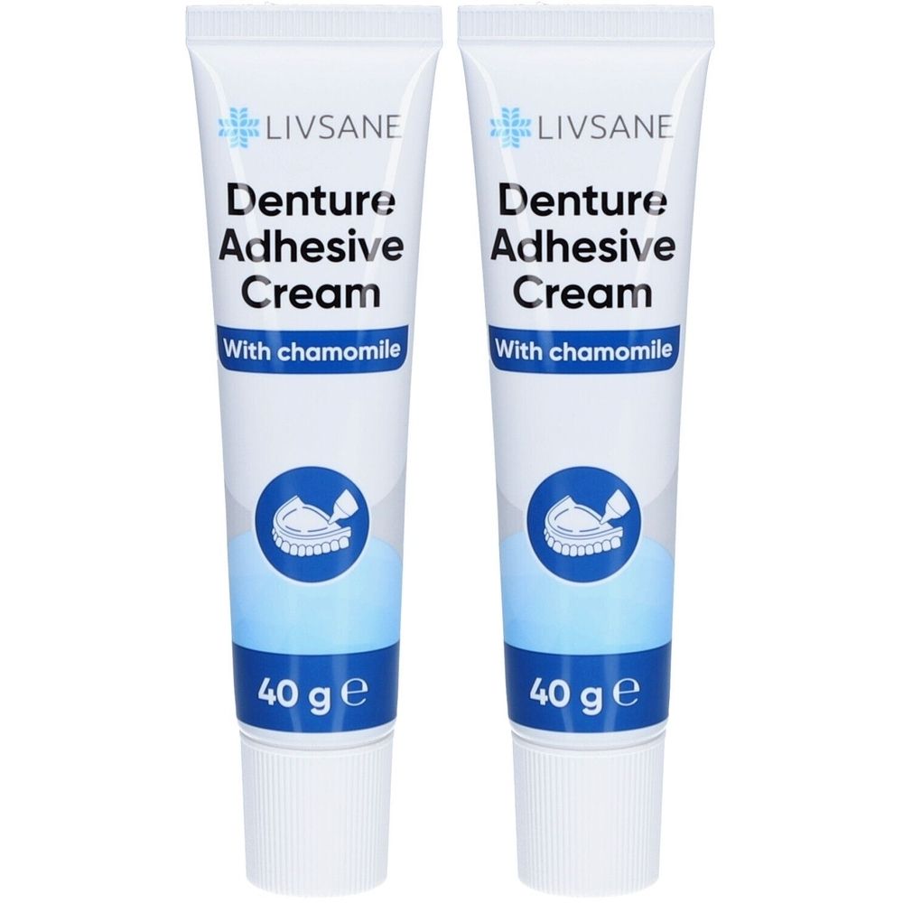 Zwei Tuben Livsane Prothesenhaftcreme mit Kamille. Aufschrift: Denture Adhesive Cream, 40 g. Logo mit Gebiss.