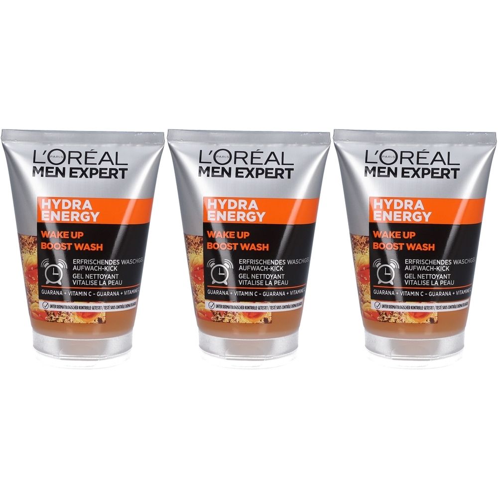 Drei Tuben L'Oréal Men Expert Hydra Energy. Silberne Tuben mit orangefarbenem Streifen und Produktbezeichnungen. Aufschrift: Wake Up Boost Wash.
