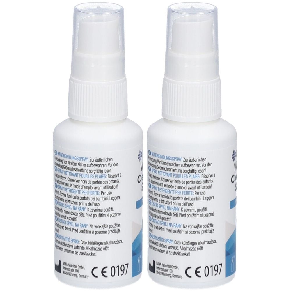 Deux flacons pulvérisateurs blancs avec des bouchons transparents. Texte et marquage CE 0197 sur les étiquettes.