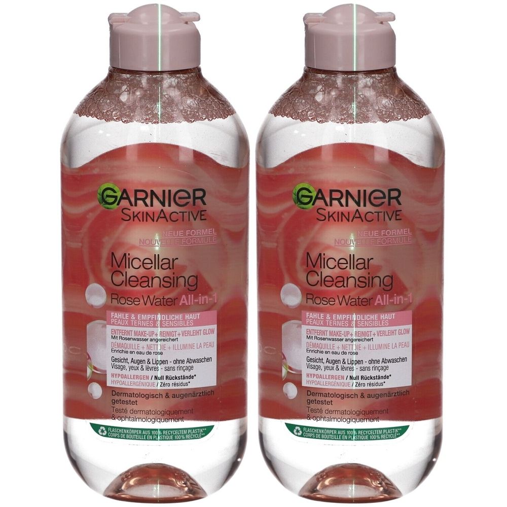 Zwei Flaschen Garnier SkinActive Mizellares Reinigungswasser mit Rosenwasser. Rosa Deckel, transparente Flaschen mit rosa Flüssigkeit.