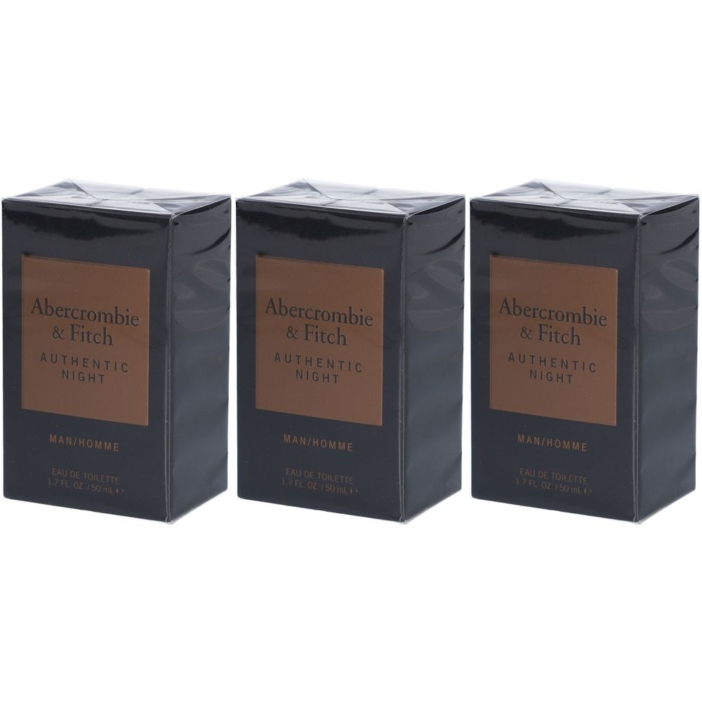 Trois boîtes noires rectangulaires avec des étiquettes marron. Les étiquettes indiquent "Abercrombie & Fitch Authentic Night".