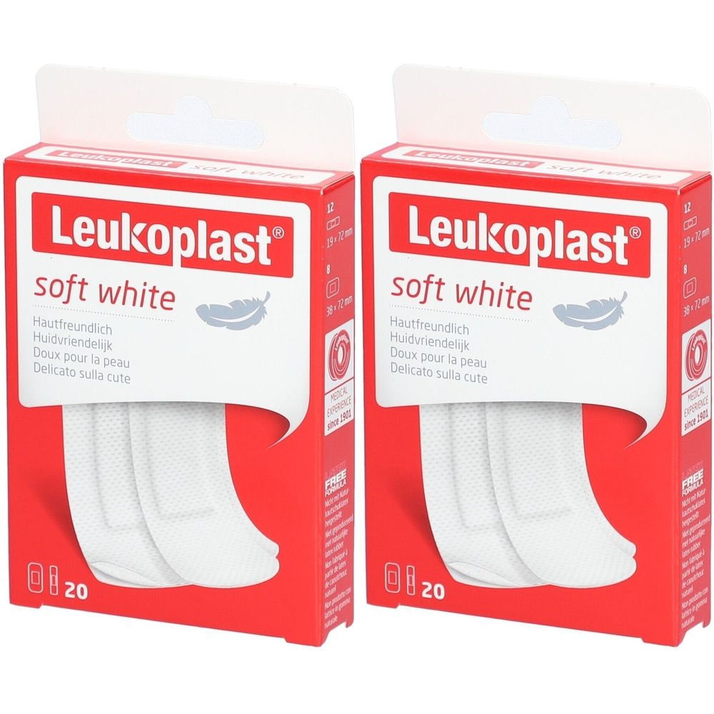 Zwei Packungen Pflaster. Rote Schachteln mit weißem Aufdruck. Aufschrift: Leukoplast soft white. Sichtbar sind weiße Pflasterstreifen.