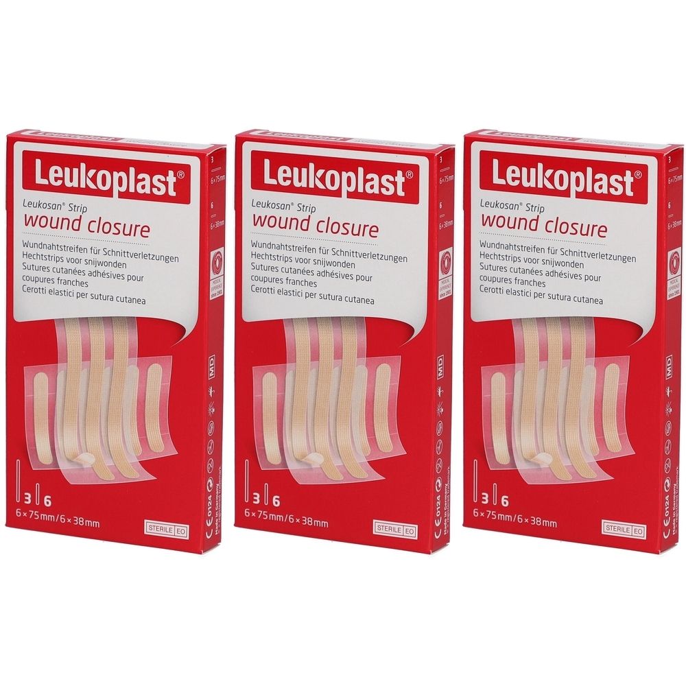 Trois boîtes de fermeture de plaie Leukoplast. Emballage rouge avec image du produit et texte. Contient 6 bandes.