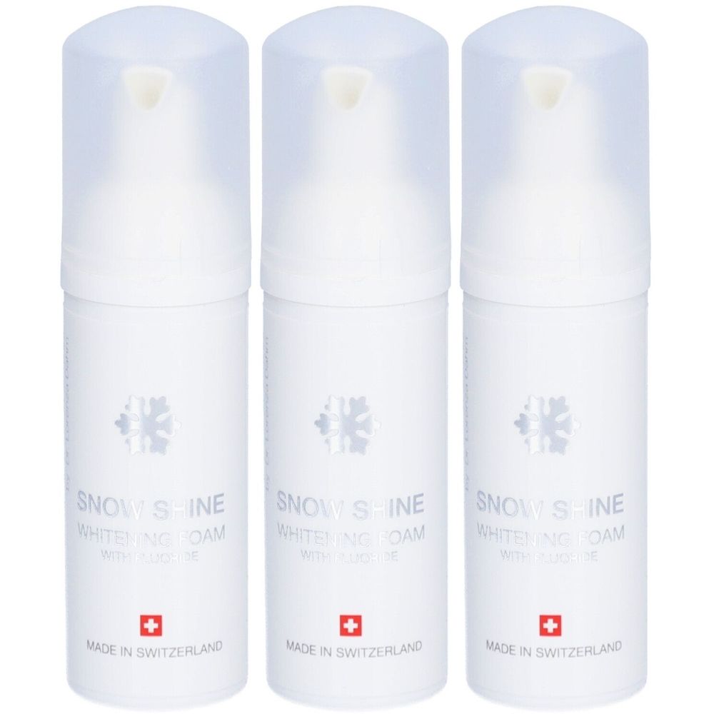 Trois flacons blancs avec vaporisateur. Inscription: Snow Shine Whitening Foam avec fluorure. Croix suisse. Fabriqué en Suisse.