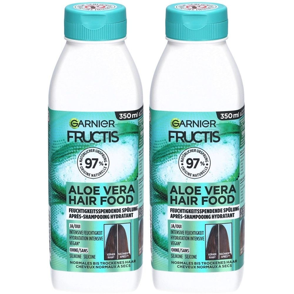 Zwei Flaschen Garnier Fructis Aloe Vera Hair Food. Weiße Flaschen mit türkisfarbenen Deckeln und Etiketten. Text: 97%, 350ml.