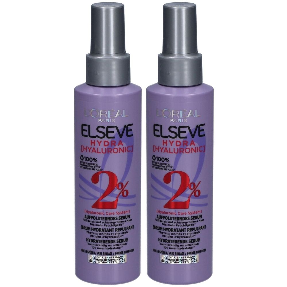 Zwei Flaschen L'Oréal Paris Elseve Hydra Hyaluronic Serum. Lila Flaschen mit silbernen Sprühköpfen. Text: Elseve, Hydra, 2%.