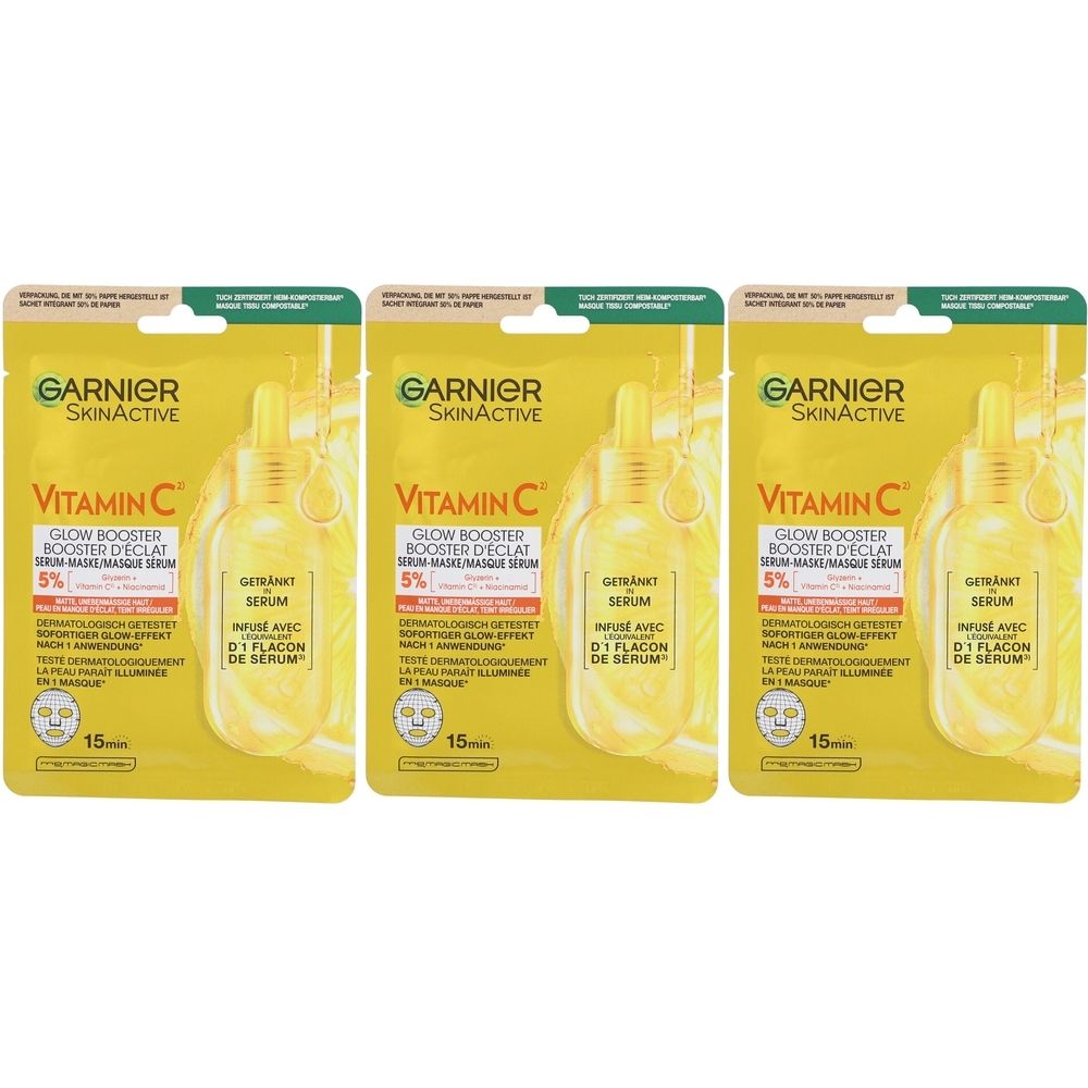 Drei Garnier SkinActive Vitamin C Glow Booster Tuchmasken. Gelbe Verpackung mit Produktabbildung und Text. 15 Minuten Anwendungszeit.