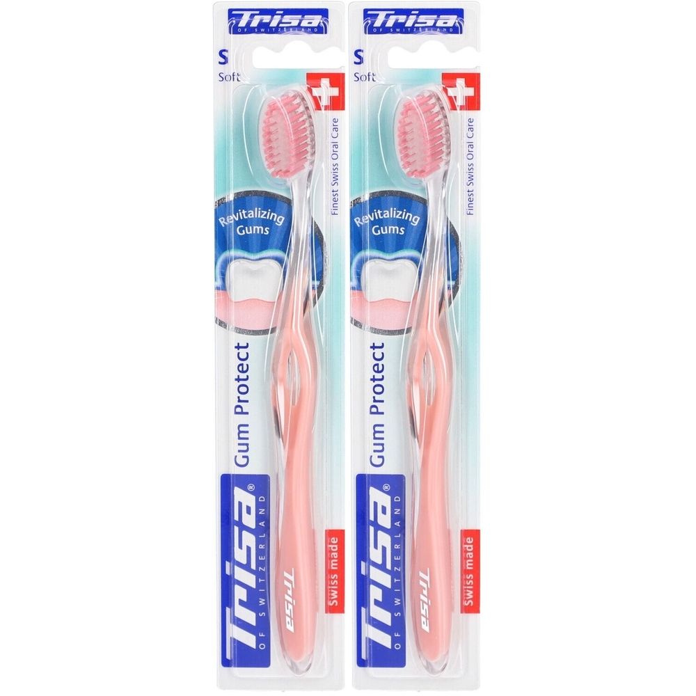 Deux brosses à dents emballées. Soies et manche roses. Inscription : Trisa Gum Protect, Swiss made.