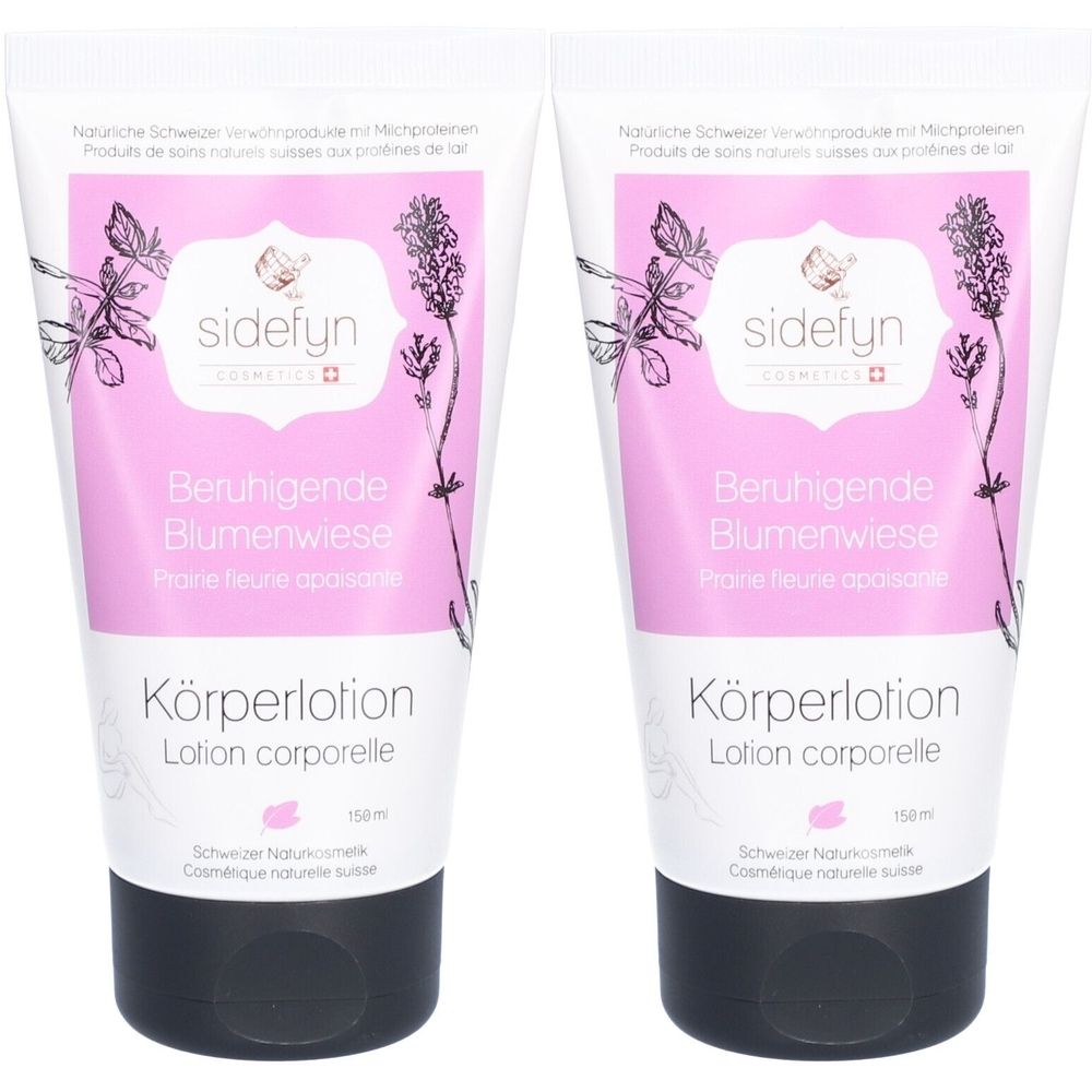Deux tubes de lotion pour le corps. Tubes blancs avec étiquette rose, motif floral et texte. Bouchon à vis noir. Texte: Prairie fleurie apaisante.