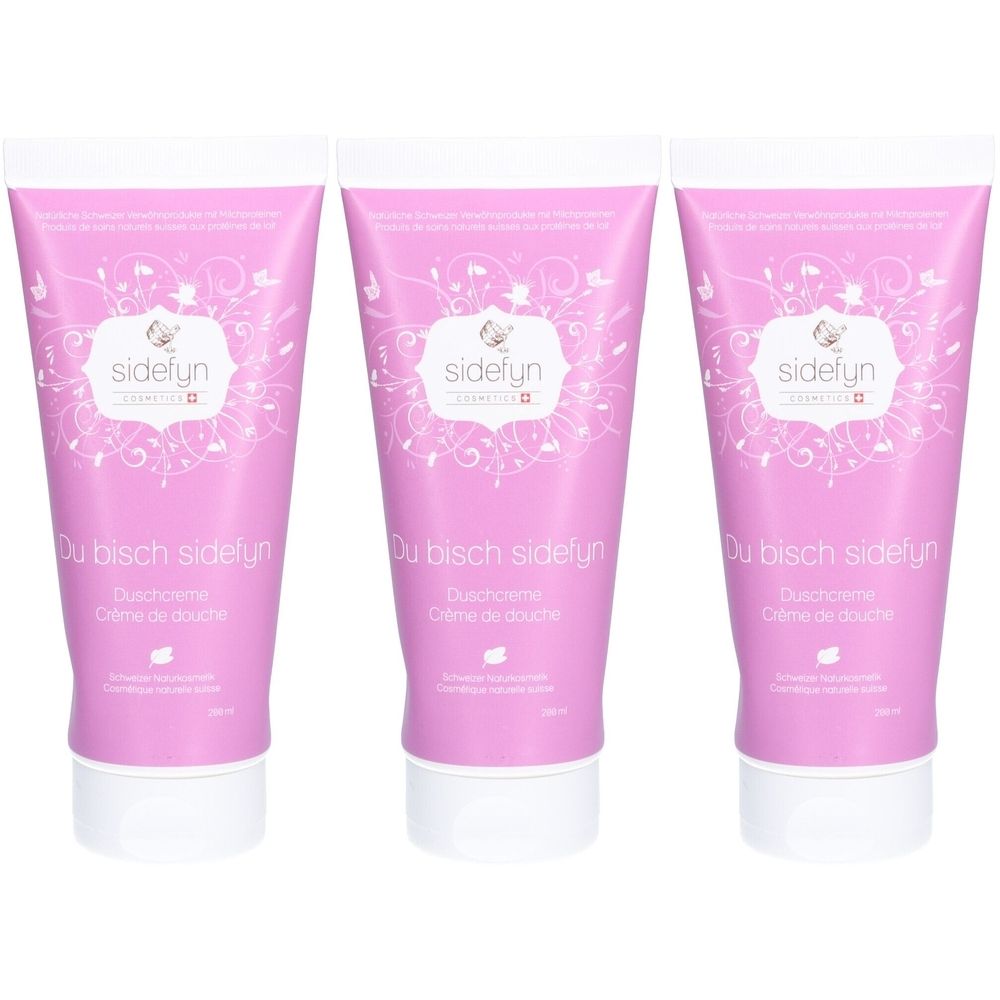 Trois tubes de crème de douche roses avec des inscriptions blanches. Inscriptions: sidefyn, Du bisch sidefyn, Duschcreme, Crème de douche.