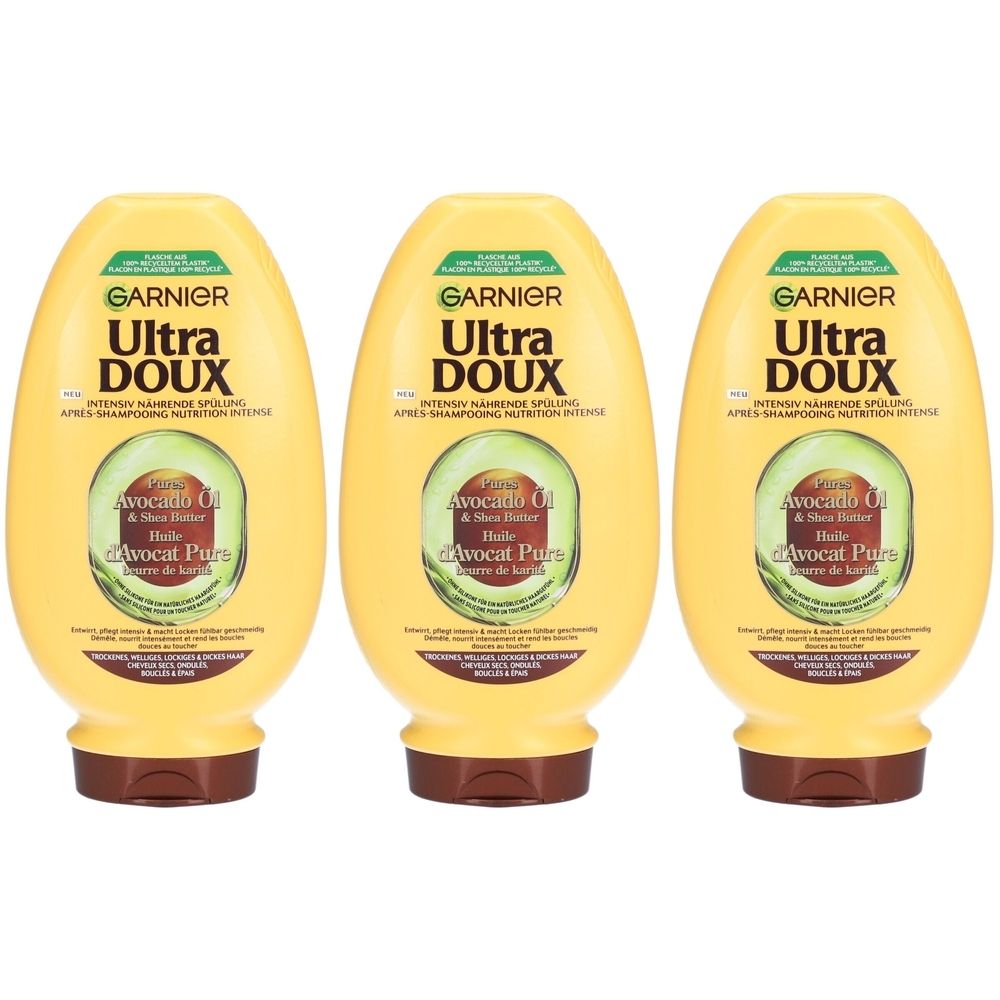 Trois flacons jaunes. Sur chacun, on lit "GARNIER Ultra DOUX" et "Avocat Pure".