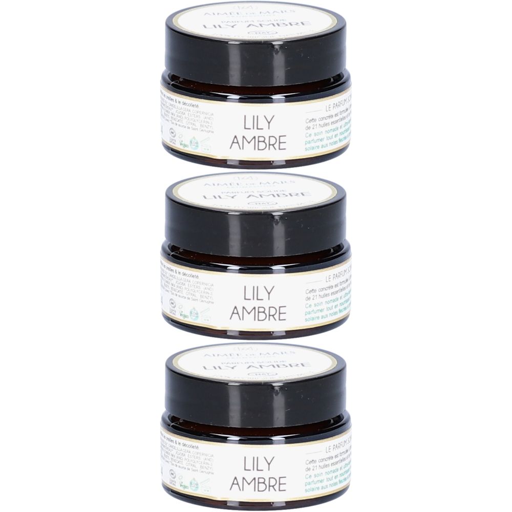 Drei kleine, runde Tiegel mit schwarzem Deckel. Auf dem Etikett steht "LILY AMBRE".
