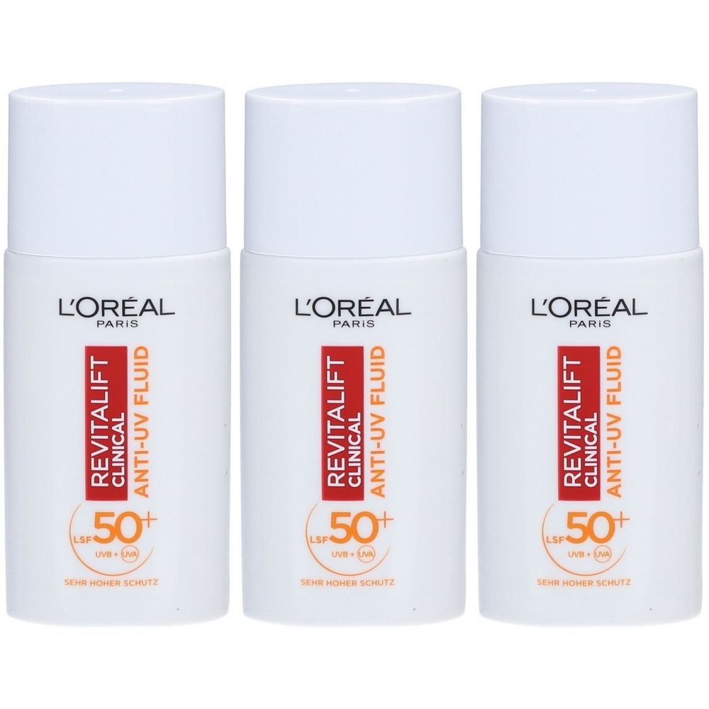 Drei weiße Flaschen L'Oréal Revitalift Clinical Anti-UV Fluid. Aufschrift: LSF 50+. Orangefarbene und rote Schrift.