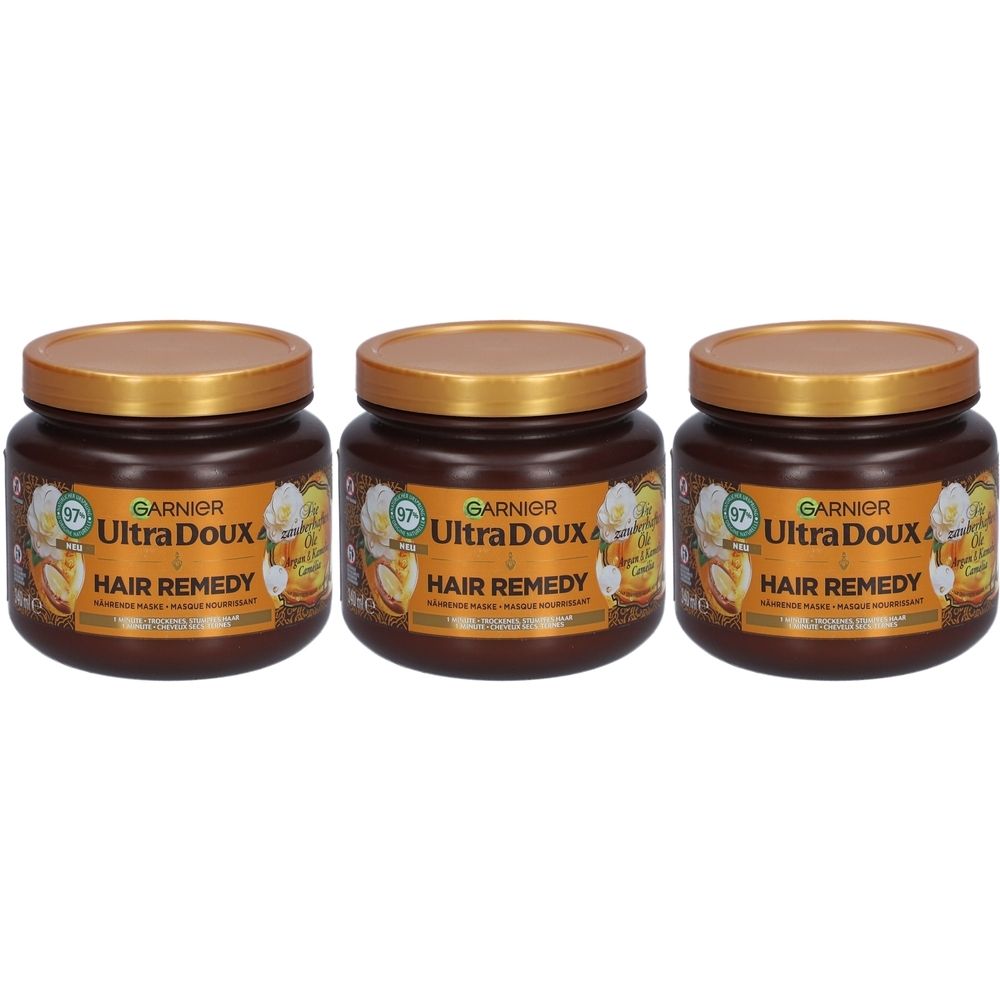 Drei braune Tiegel mit goldenen Deckeln. Auf den Etiketten steht Garnier Ultra Doux Hair Remedy.