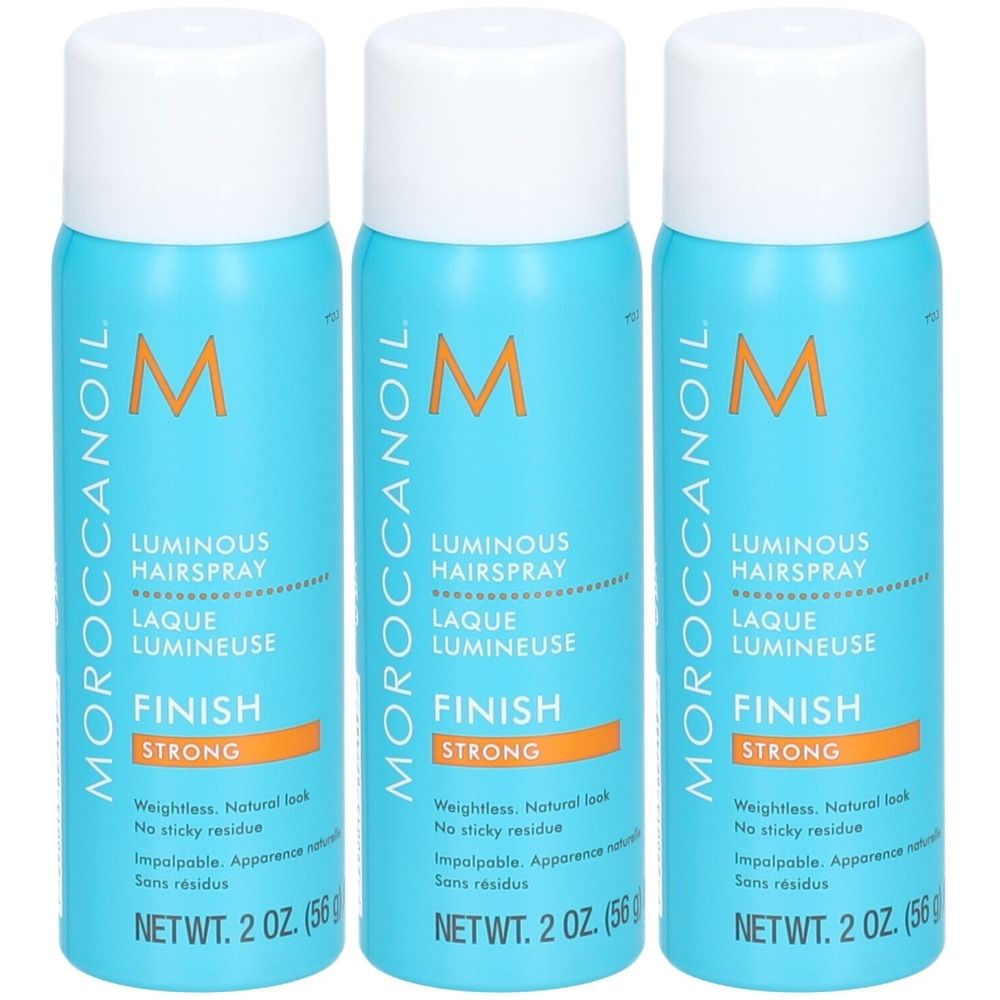 Trois flacons de laque pour cheveux avec bouchons blancs. Inscription : Moroccanoil, Luminous Hairspray Finish Strong. Flacons bleu turquoise.