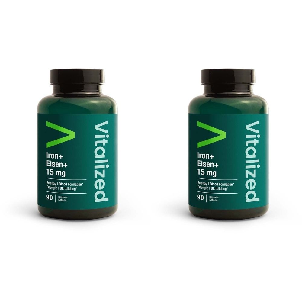 Deux flacons verts avec bouchons noirs. Inscription: Vitalized, Iron+ Eisen+ 15 mg, 90 capsules.