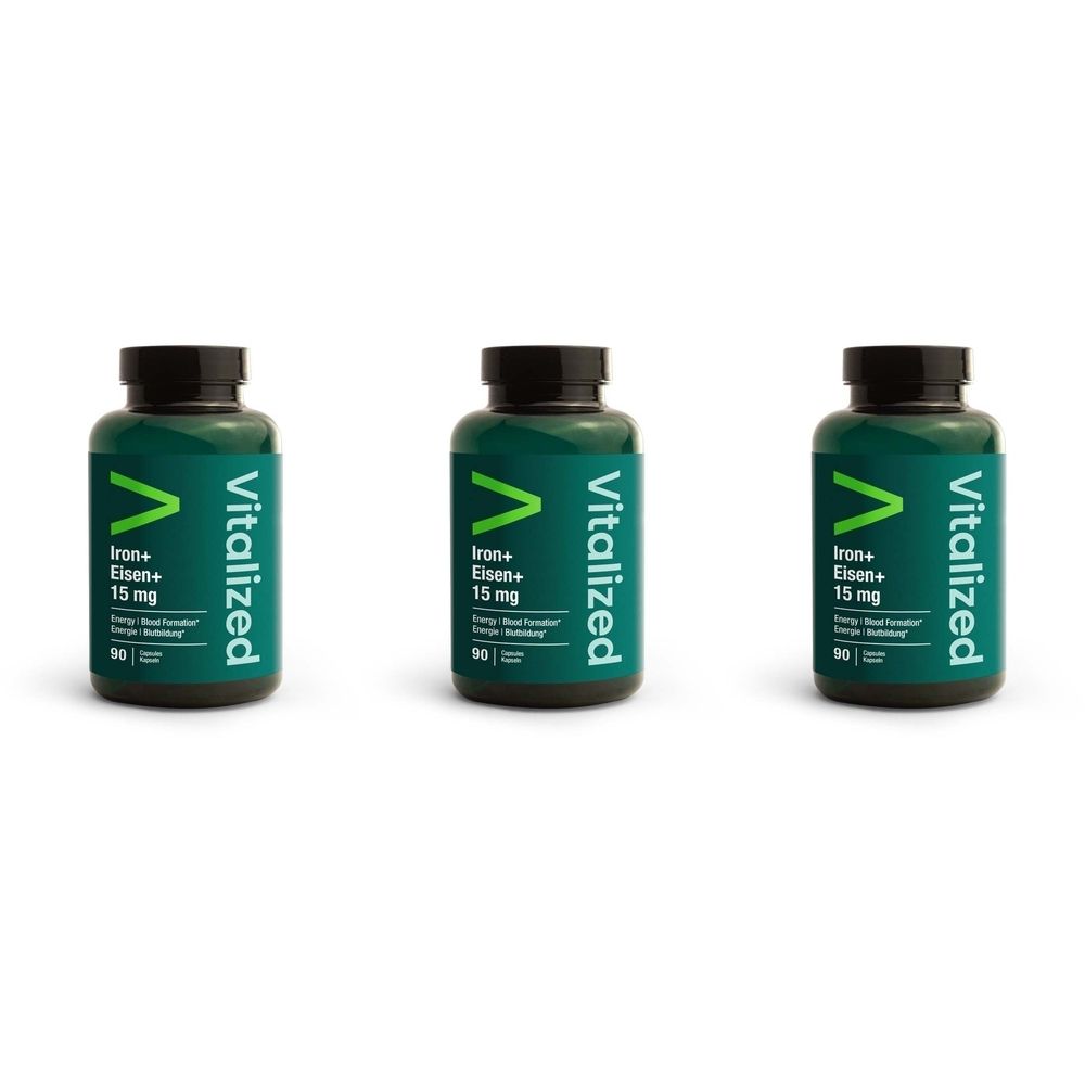 Trois flacons verts avec des bouchons noirs. Inscription: Vitalized, Iron+ Eisen+ 15 mg. 90 capsules.
