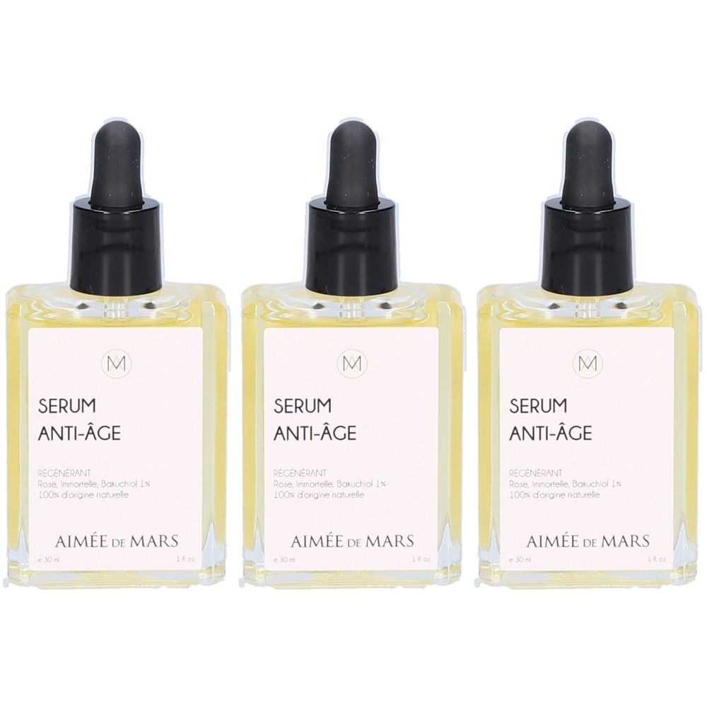 Drei Flaschen Serum Anti-Age mit schwarzer Pipette. Aufschrift: AIMÉE DE MARS. Auf jeder Flasche ist ein weißes Etikett mit Text.