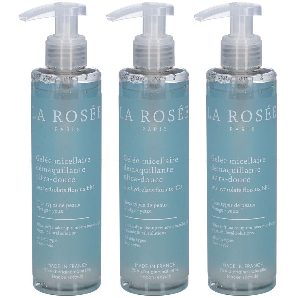 Trois flacons de gel nettoyant transparent. Inscription : LA ROSÉE PARIS. Avec pompe et liquide bleu.