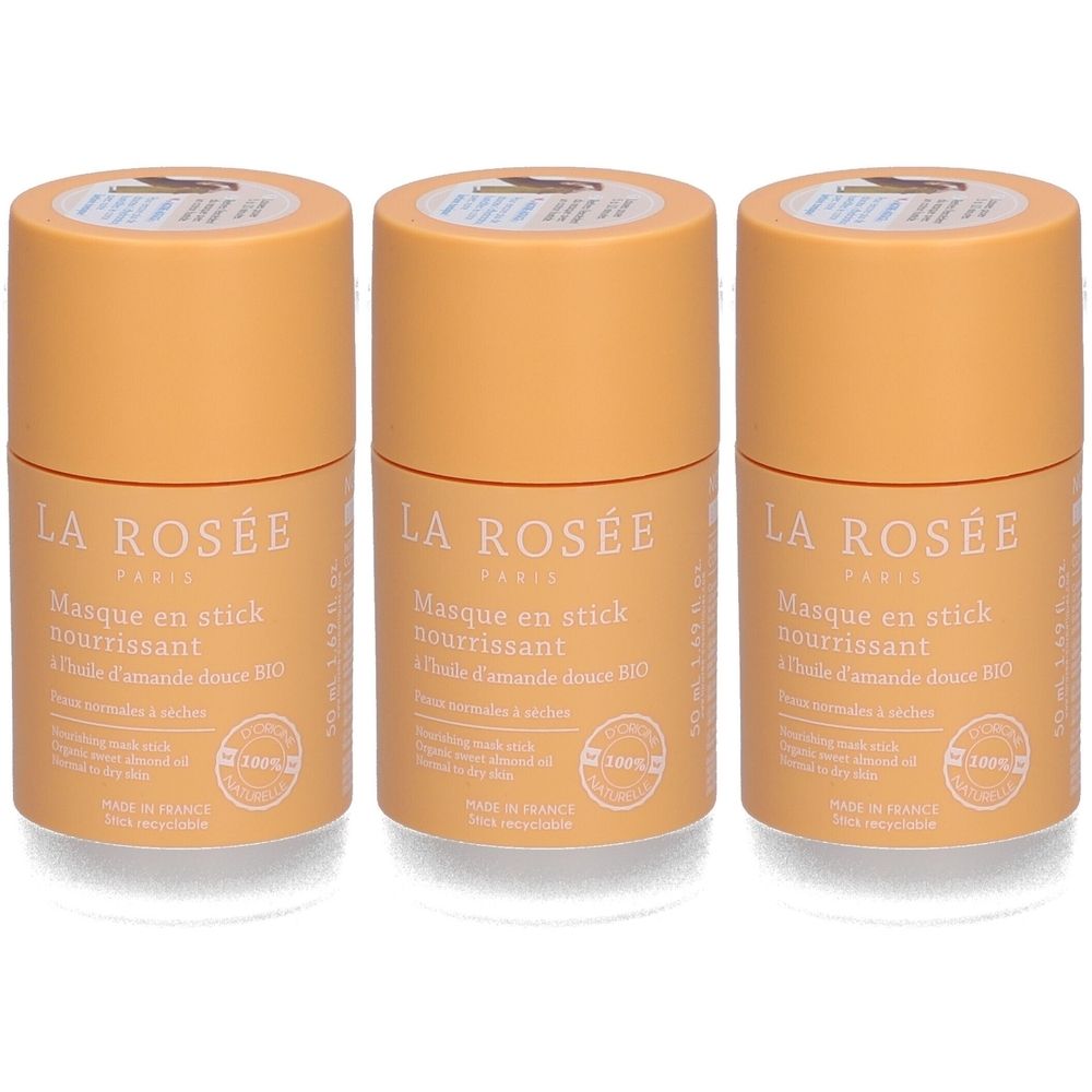 Trois tubes cylindriques orange. Inscription: LA ROSÉE, Masque en stick nourrissant, à l'huile d'amande douce BIO. Fabriqué en France.