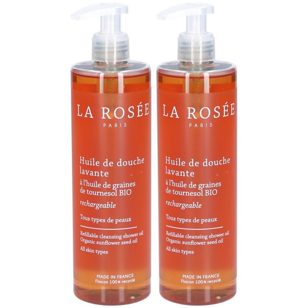 Deux flacons oranges avec pompe. Inscription: LA ROSÉE PARIS, Huile de douche lavante, à l'huile de graines de tournesol BIO, rechargeable.
