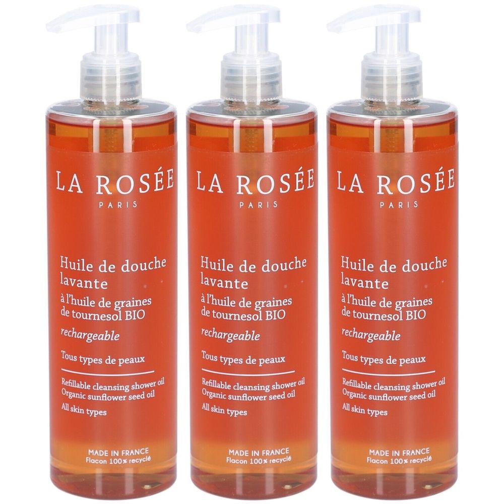 Trois flacons d'huile de douche La Rosée avec pompe. Inscription : Huile de douche lavante, à l'huile de graines de tournesol BIO, Tous types de peaux.