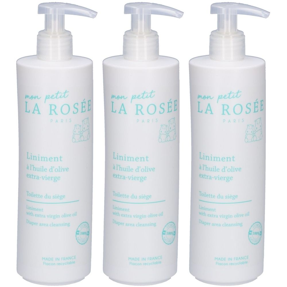 Trois flacons blancs avec pompe. Inscription: LA ROSÉE, Liniment à l'huile d'olive extra-vierge. Pour le nettoyage des couches.