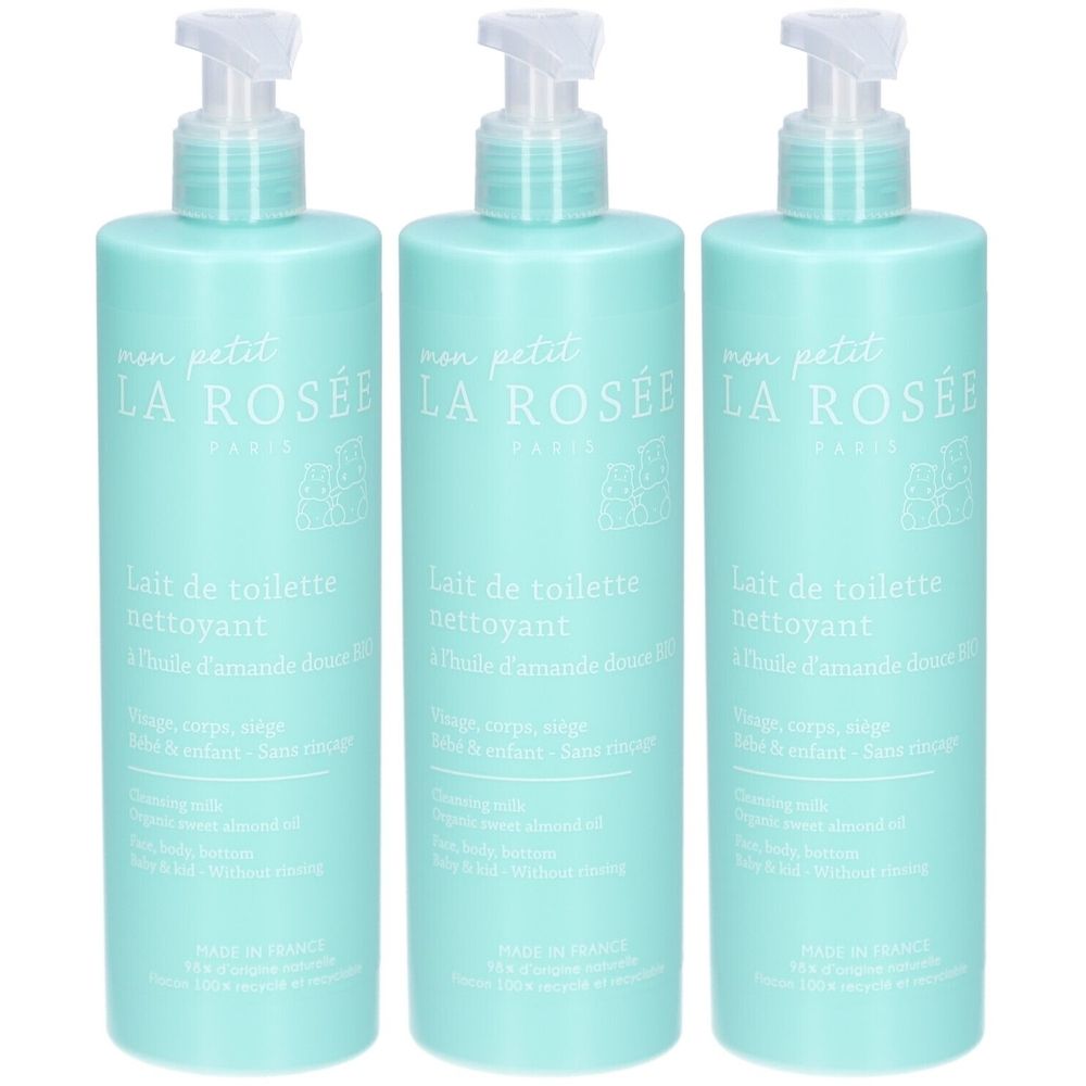 Trois flacons de lait nettoyant pour bébé LA ROSÉE avec pompe. Flacons bleu clair avec texte et logo blancs. Inscription en français.